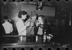 People_drinking_at_the_bar,_saloon,_Raceland,_Louisiana